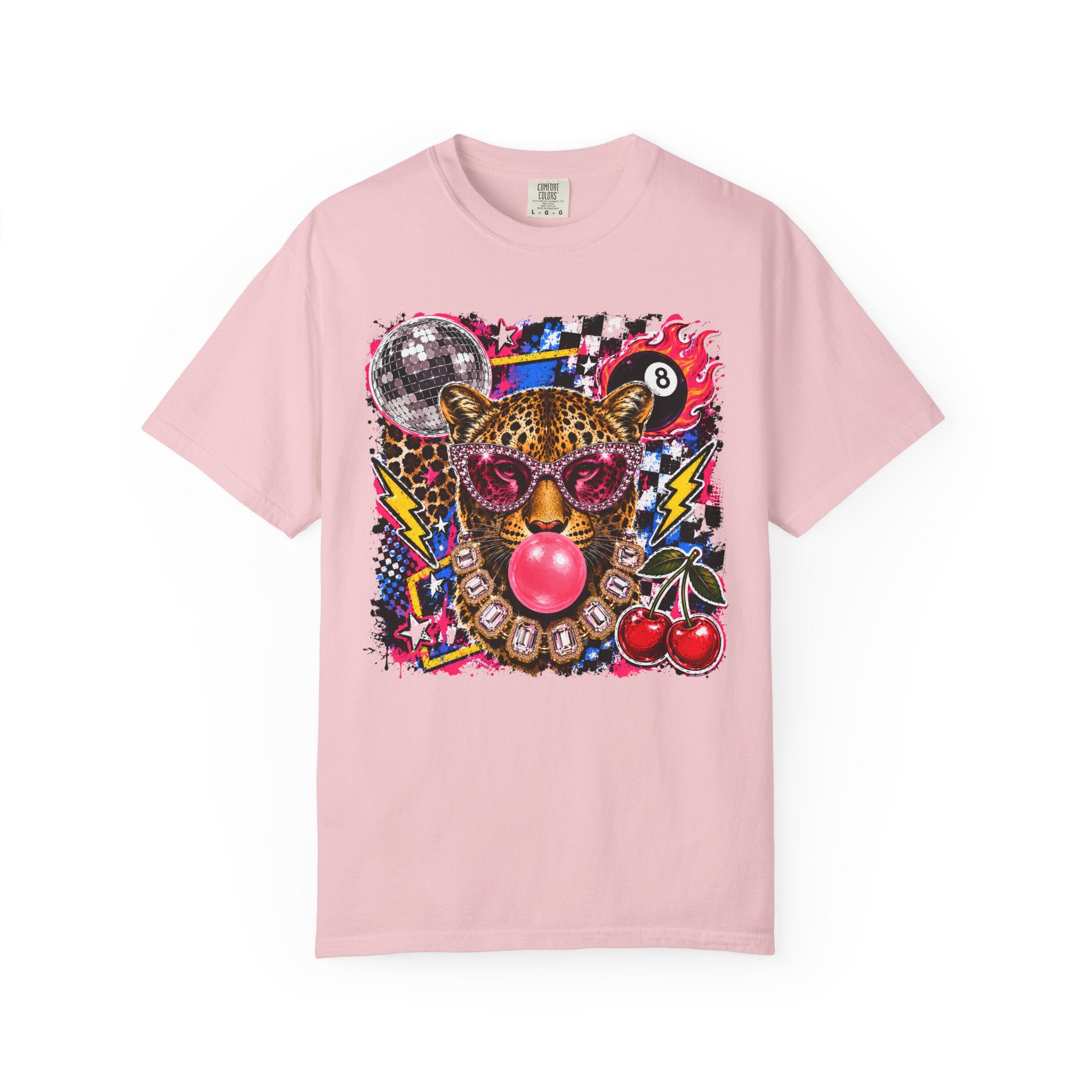A blossom pink short-sleeve crewneck t-shirt featuring a vibrant, multicolored graphic print of a leopard wearing sunglasses and blowing a pink bubblegum bubble, surrounded by cherries, a disco ball, and a 8-ball on a white background.