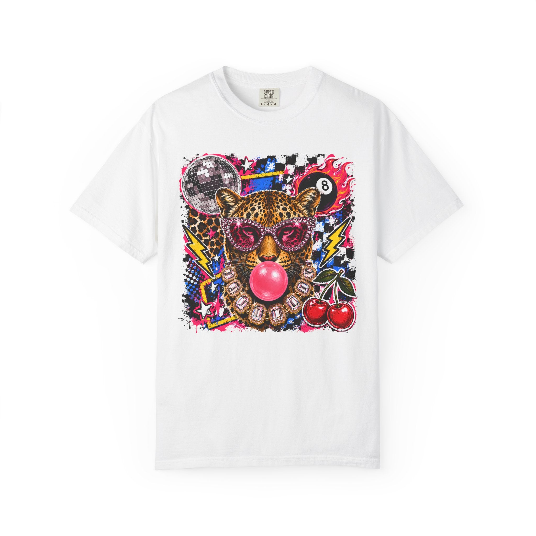 A white short-sleeve crewneck t-shirt featuring a vibrant, multicolored graphic print of a leopard wearing pink sunglasses and blowing a pink bubblegum bubble, surrounded by retro game elements like an 8-ball, cherries, and a disco ball.