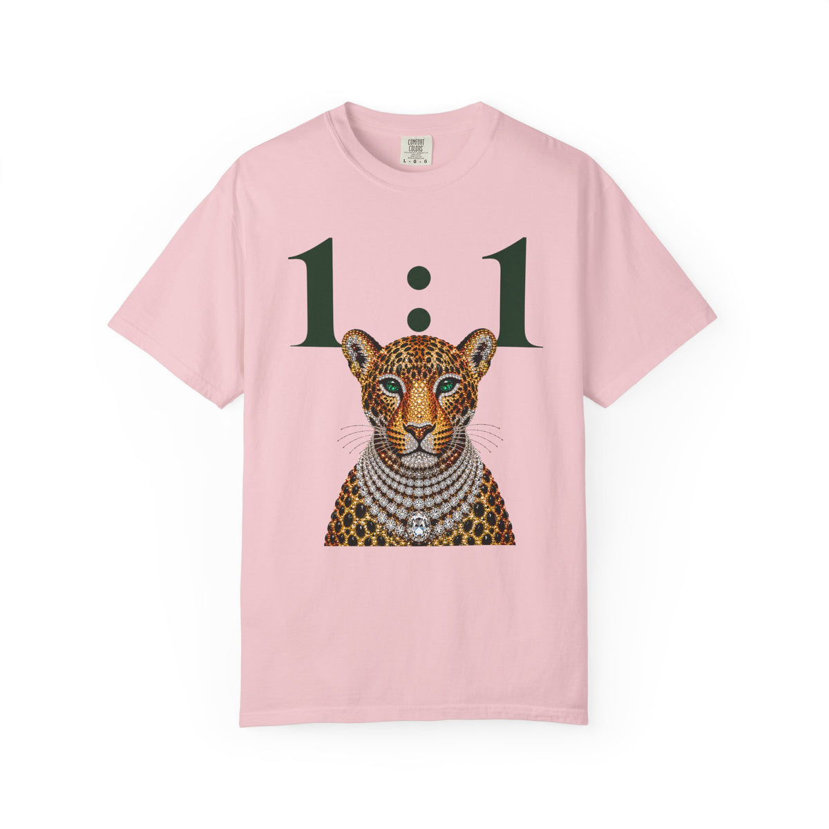 A light pink short-sleeve t-shirt featuring a graphic print of a leopard wearing a diamond necklace, with the text '1:1' printed above it.