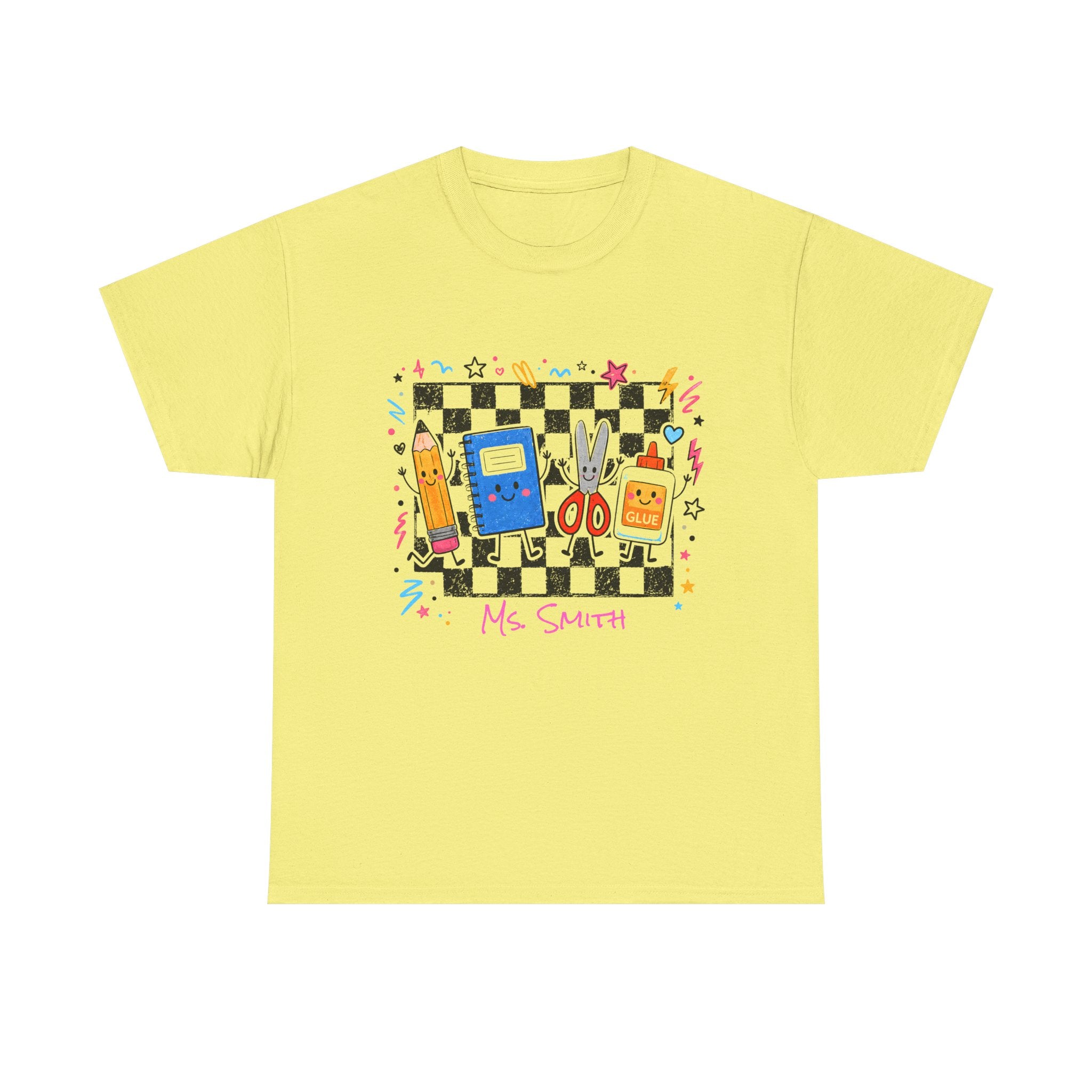 A cornsilk short-sleeve crewneck t-shirt featuring a colorful retro-themed graphic on the chest. The graphic depicts a black and white checkerboard background with various cartoon school supplies, a blue notebook device, a yellow pencil, scissors, glue bottle and the text 'Ms. Smith'