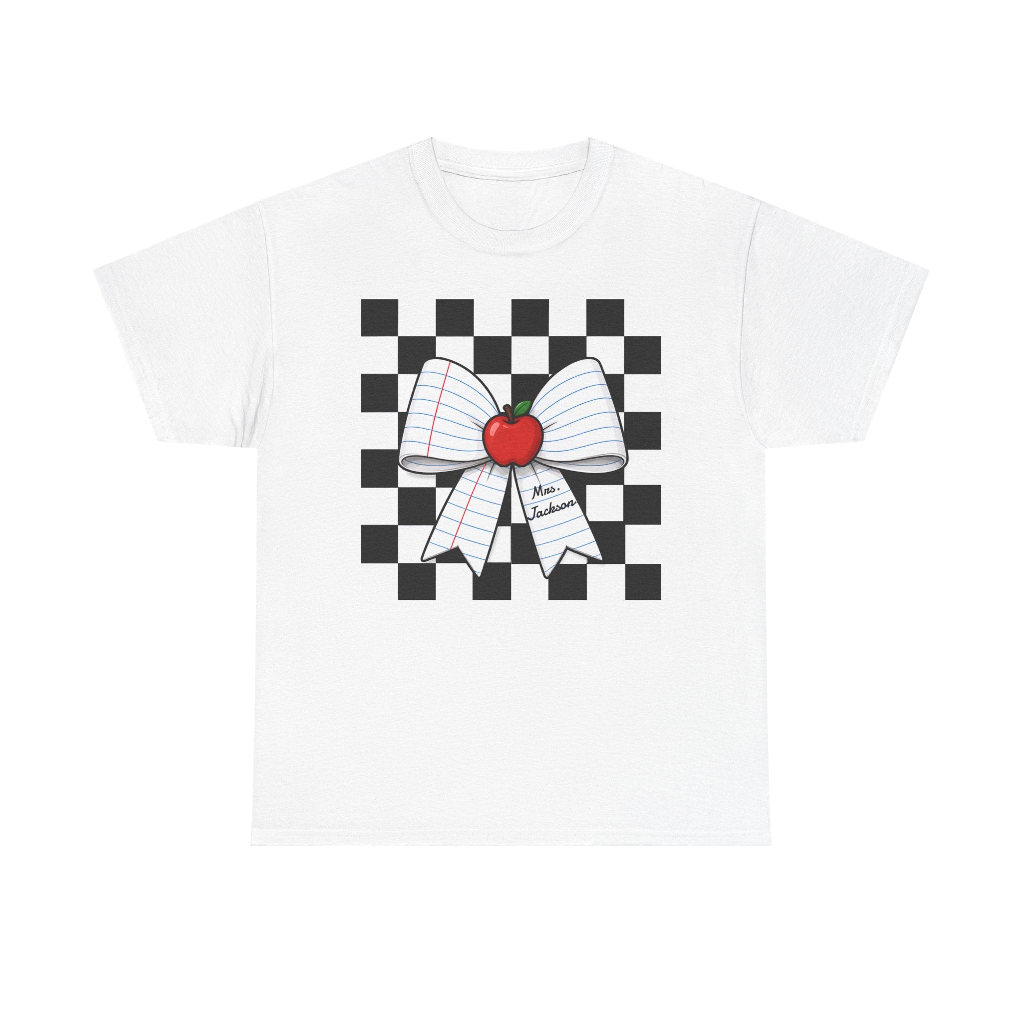 A white short-sleeve crewneck t-shirt featuring a graphic print of a black and white checkered square background with a white lined paper bow and a red apple at the center.