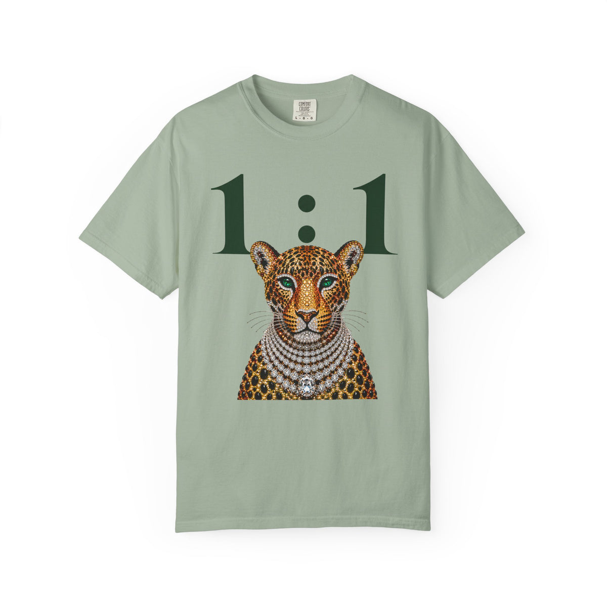 A sage green short-sleeve t-shirt featuring a graphic print of a leopard wearing a diamond necklace, with the text '1 : 1' printed above it.