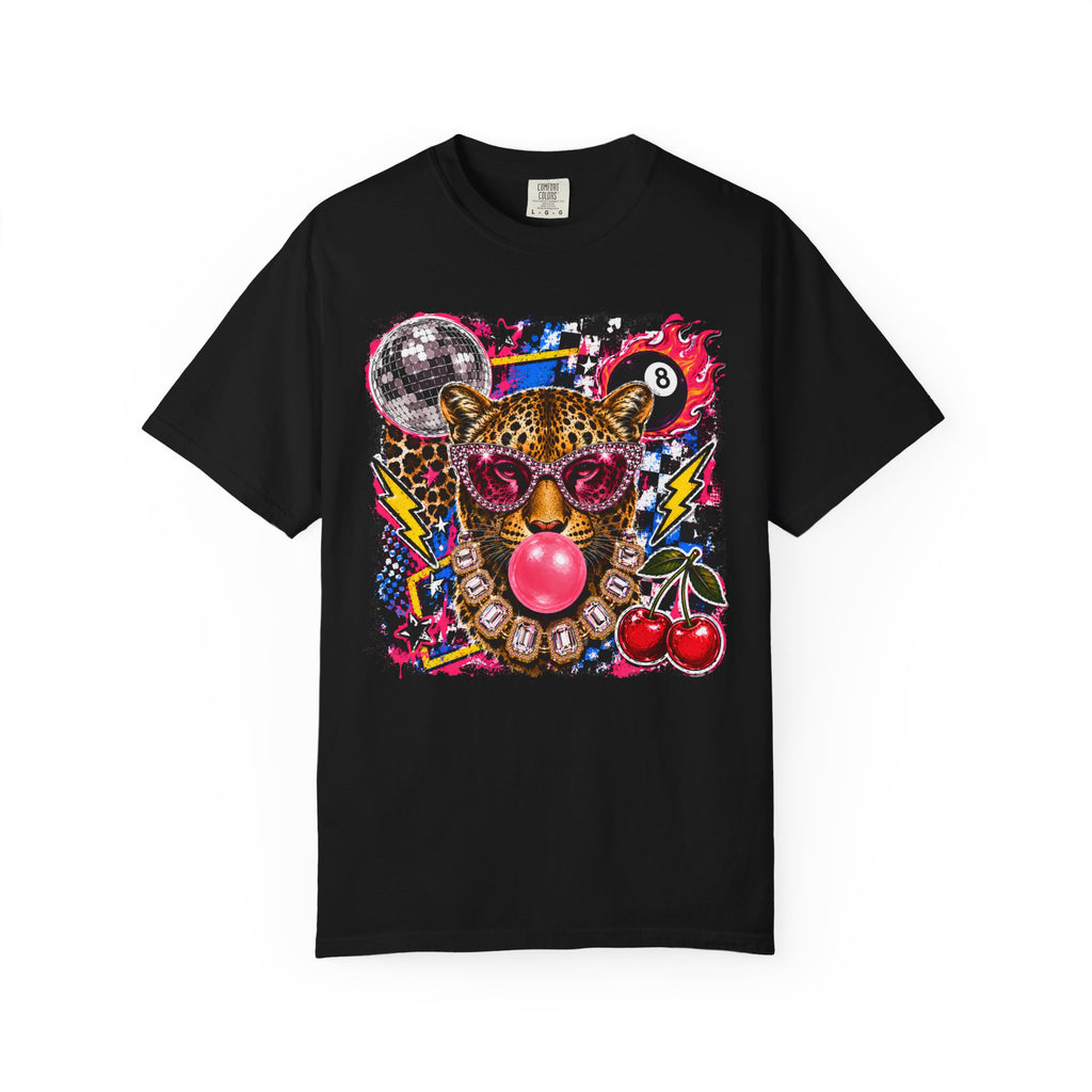A black short-sleeve crewneck t-shirt featuring a vibrant, colorful graphic print of a leopard wearing pink sunglasses and blowing a pink bubblegum bubble, surrounded by disco elements like a vinyl record, lightning bolts, cherries, and an 8-ball on a white background.