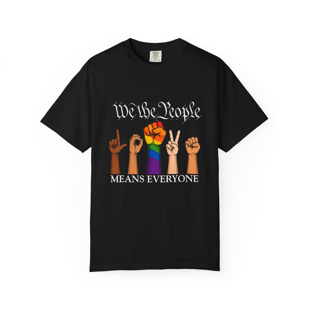 Black unisex graphic T-shirt featuring the phrase "We The People Means Everyone" with diverse illustrated hands spelling "LOVE" in sign language, an LGBTQ+ rainbow  raised fist in between. Inclusive Pride and equality statement shirt for everyday wear.