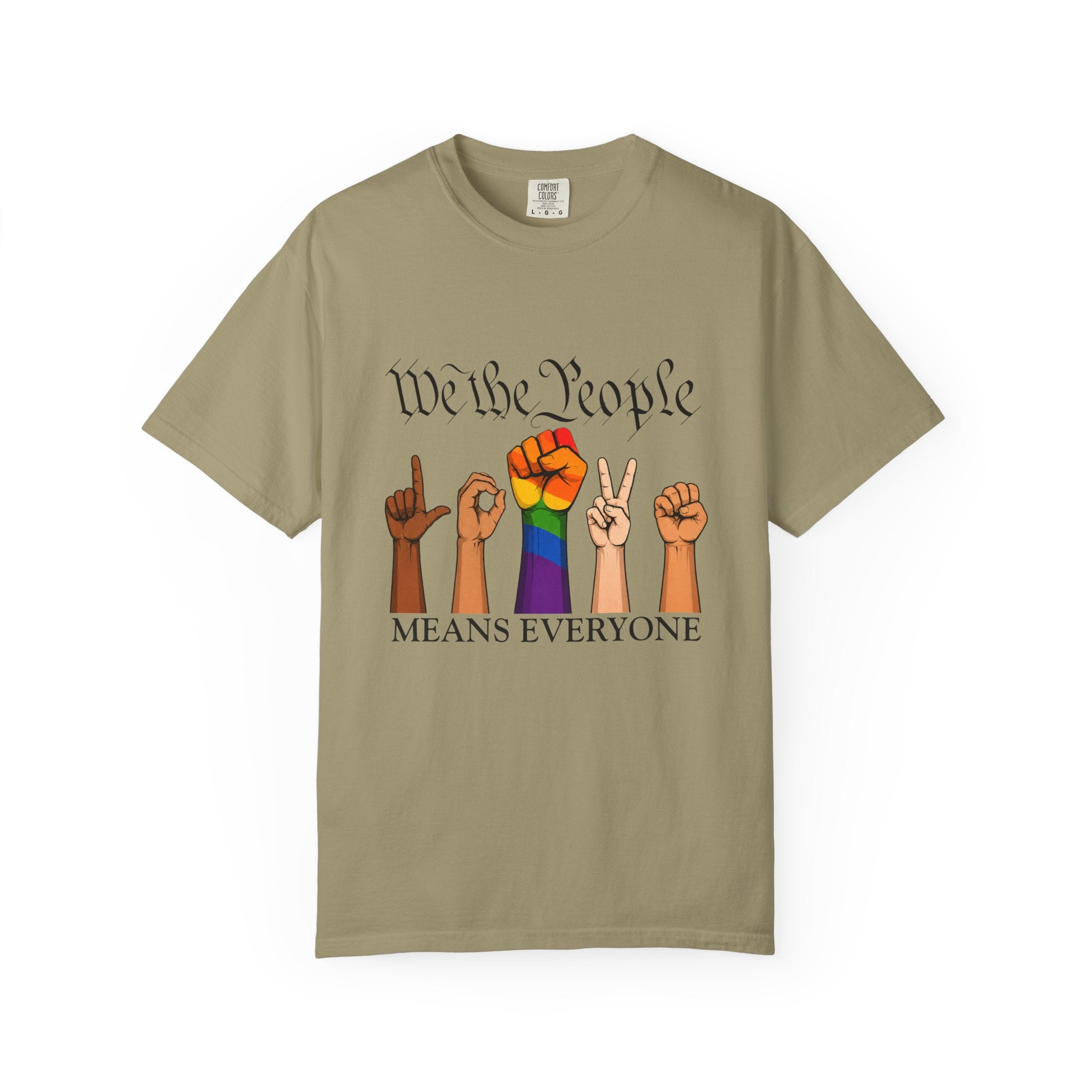 Khaki unisex graphic T-shirt featuring the phrase "We The People Means Everyone" with diverse illustrated hands spelling "LOVE" in sign language, an LGBTQ+ rainbow  raised fist in between. Inclusive Pride and equality statement shirt for everyday wear.